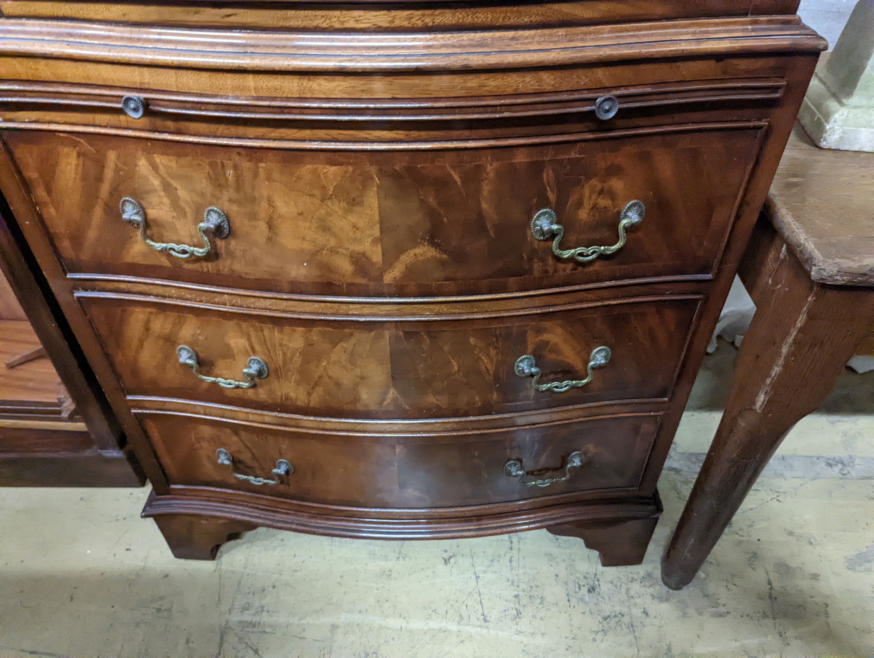 A reproduction George III style mahogany bow front tallboy fitted slide, width 73cm, depth 48cm, height 152cm